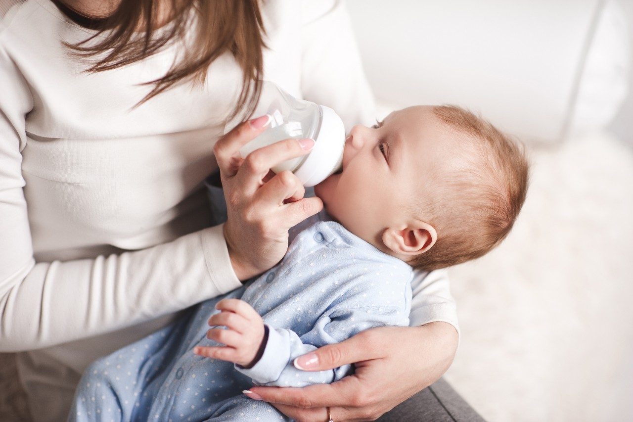 Baby drinking milk from bottle