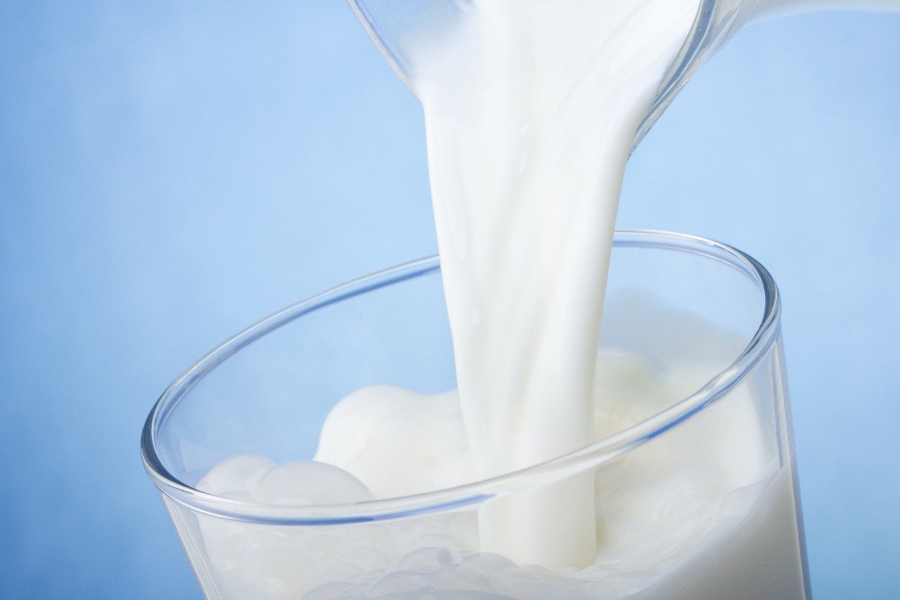 milk pouring into glass