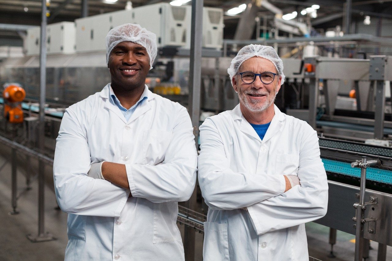 Two factory engineers smiling