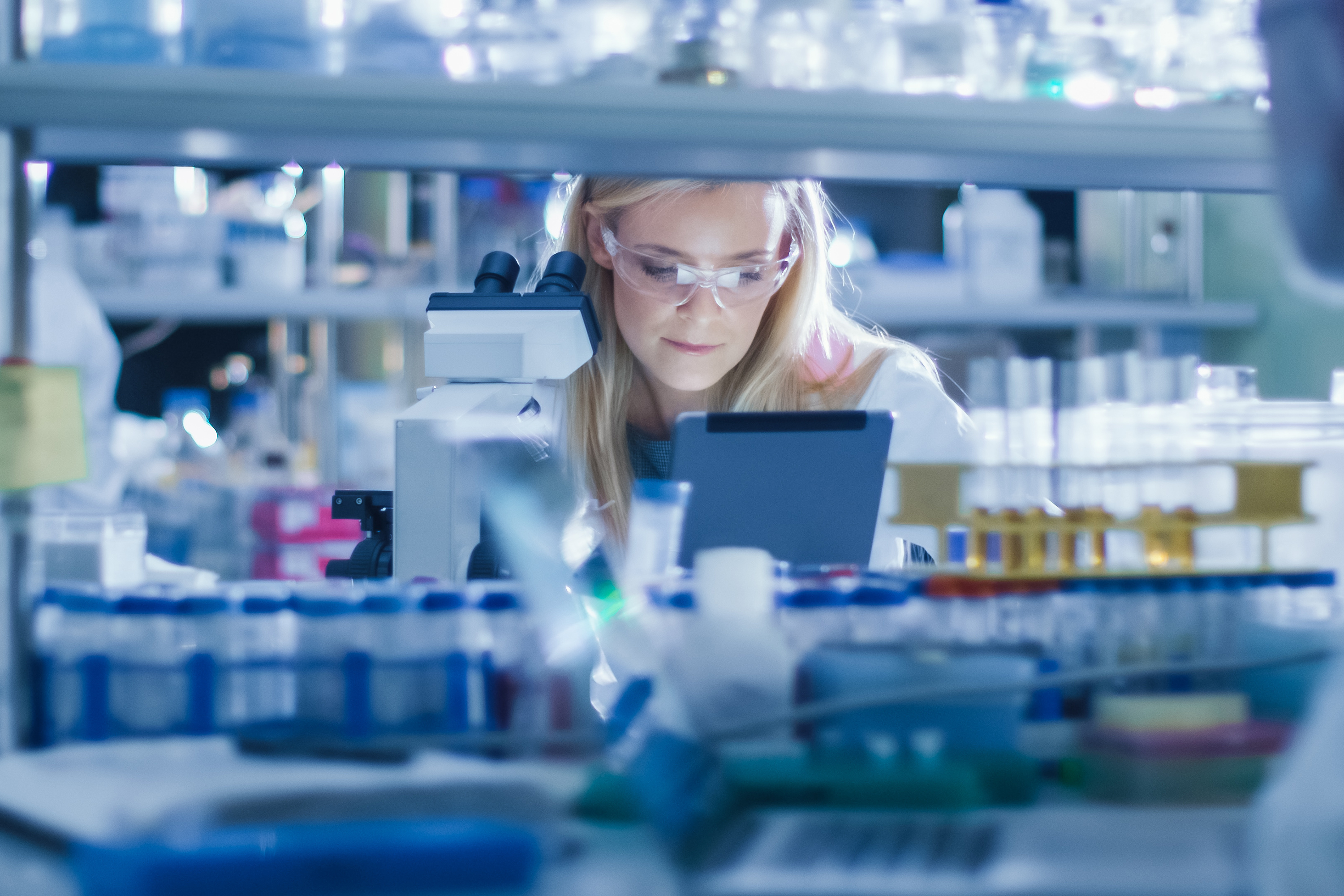 Scientist using tablet working in lab