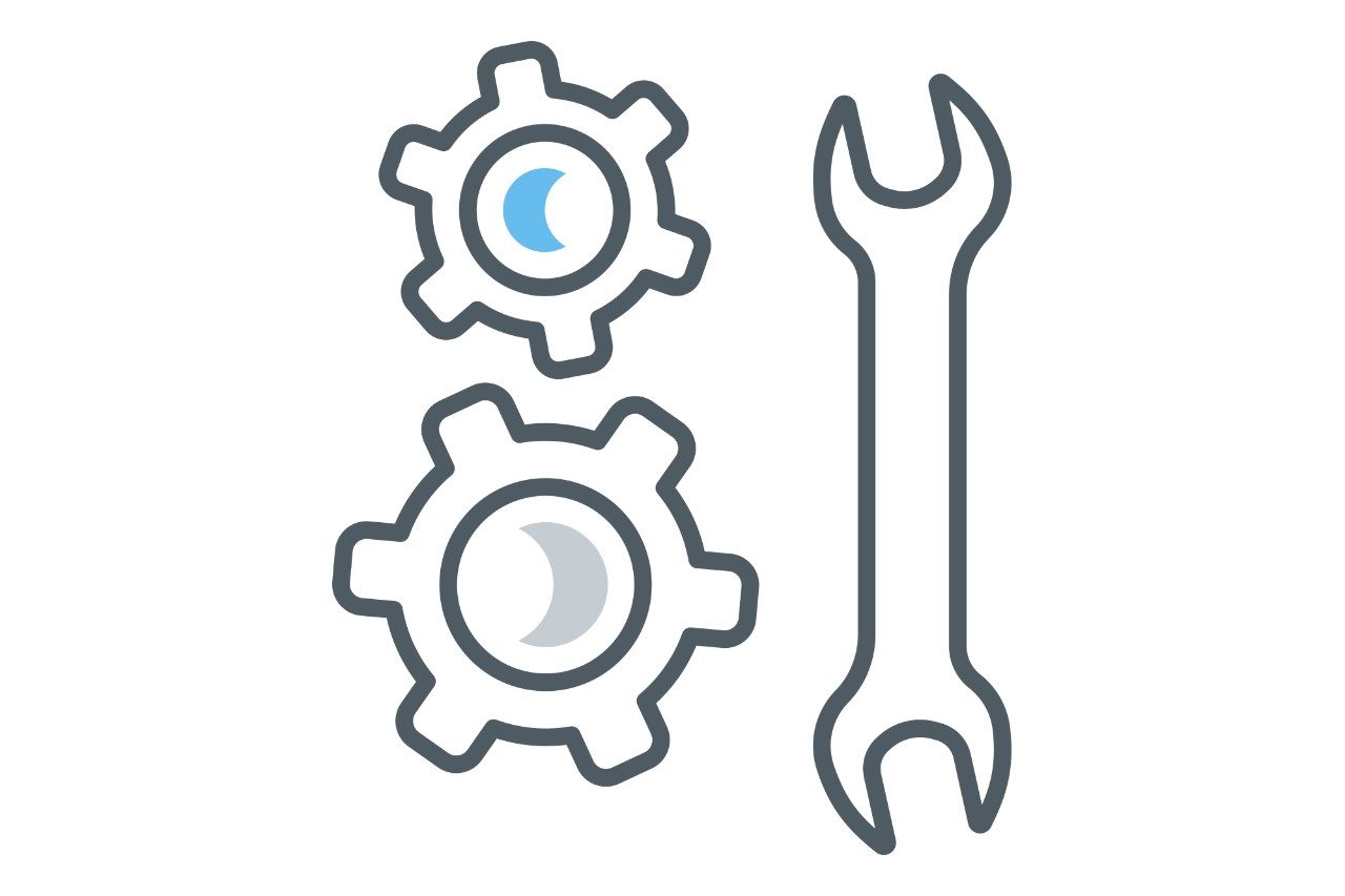 line drawing of gears with a wrench